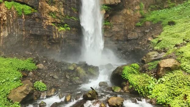 Aerial view of Kapas Biru Waterfall in Indonesia. Aerial view of Kapas Biru Waterfall in Indonesia.
