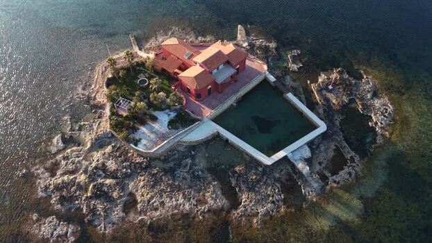 Aerial view of Isolotto Brancati and its red villa Italy. Aerial view of Isolotto Brancati and its red villa Italy.