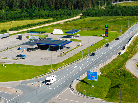 Saulgozi Kekava Municipality Latvia 05 July 2026 Aerial view of the Virsi gas station along the Via Baltica road with fuel pumps a convenience store and green fields.