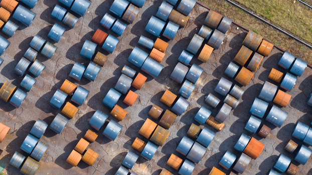 Aerial view of Tata Steel industrial site with rows of blue and rusty steel coils stored outdoors in Velsen Noord Noord Holland Netherlands. Aerial view of Tata Steel industrial site with rows of blue and rusty steel coils stored outdoors in Velsen Noord Noord Holland Netherlands.