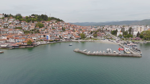 Aerial view of the historic town of Ohrid with its traditional red tiled rooftops harbor and boats on Lake Ohrid in Ohrid Municipality of Ohrid North Macedonia. Aerial view of the historic town of Ohrid with its traditional red tiled rooftops harbor and boats on Lake Ohrid in Ohrid Municipality of Ohrid North Macedonia.