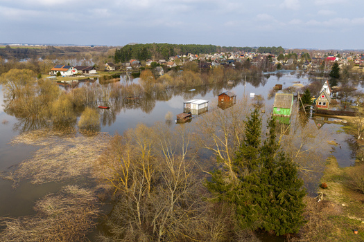 Kedainiai Lithuania 17 March 2026 Aerial view of flooded houses and submerged trees in a residential area during a spring flood under an overcast sky. Kedainiai Lithuania 17 March 2026 Aerial view of flooded houses and submerged trees in a residential area during a spring flood under an overcast sky.