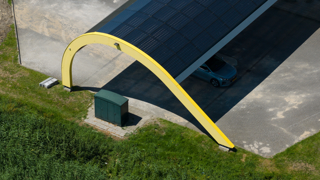 Middenbeemster Netherlands 20 June 2026 Aerial view of the Fastned charging station with its iconic yellow arched roof and solar panels sheltering an electric vehicle in a rural setting. Middenbeemster Netherlands 20 June 2026 Aerial view of the Fastned charging station with its iconic yellow arched roof and solar panels sheltering an electric vehicle in a rural setting.