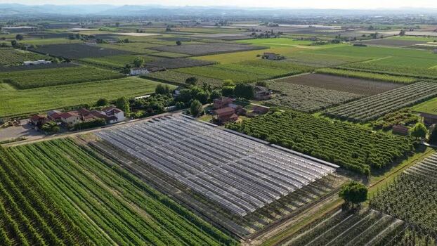 Aerial view of agricultural fields and greenhouses in Faenza Italy.