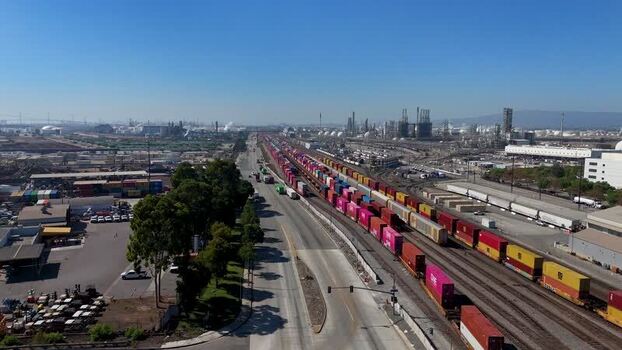 Aerial view of freight train in industrial port United States.