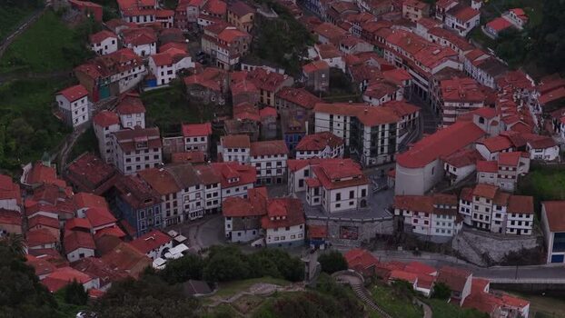 Aerial view of the colorful houses and rooftops of Cudillero Spain. Aerial view of the colorful houses and rooftops of Cudillero Spain.