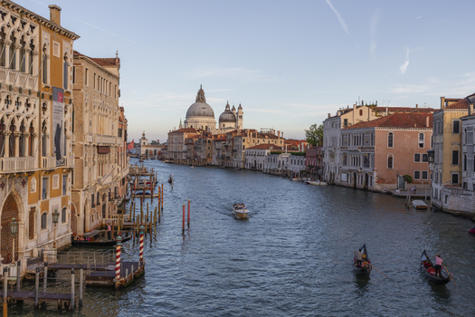 Venice Italy 21 September 2026 View of Santa Maria della Salute and gondolas on the Grand Canal with historic buildings under a clear sky. Venice Italy 21 September 2026 View of Santa Maria della Salute and gondolas on the Grand Canal with historic buildings under a clear sky.
