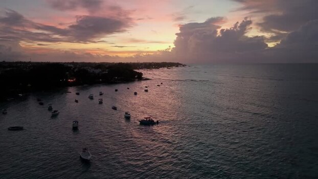 Aerial view of boats in Cap Malheureux bay at sunset Mauritius.