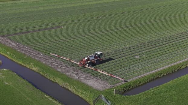 Aerial view of crops with tractor Opmeer North Holland Netherlands. Aerial view of crops with tractor Opmeer North Holland Netherlands.
