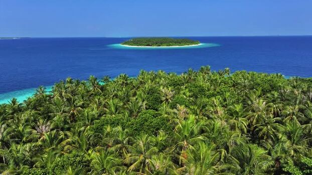 Aerial view of tropical islands and turquoise waters Maldives. Aerial view of tropical islands and turquoise waters Maldives.