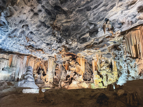 View of the Cango Caves featuring dramatic stalactites stalagmites and unique marbled ceiling textures in Oudtshoorn Western Cape South Africa. View of the Cango Caves featuring dramatic stalactites stalagmites and unique marbled ceiling textures in Oudtshoorn Western Cape South Africa.