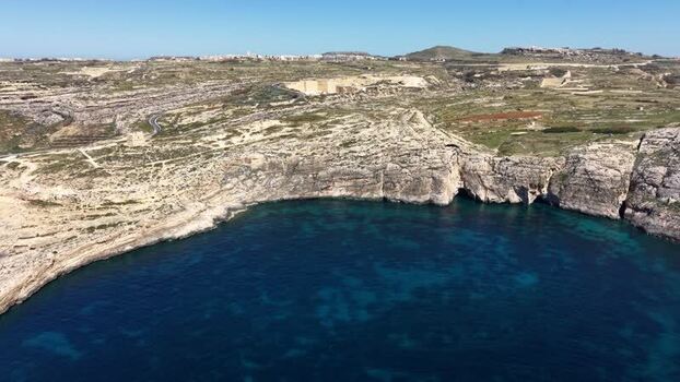 Aerial view of Dwejra Bay and rocky cliffs Malta. Aerial view of Dwejra Bay and rocky cliffs Malta.