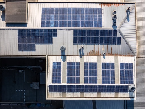 Aerial view of solar panels installed on a metal industrial rooftop in Porto Porto District Portugal.