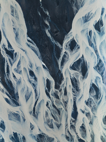 Aerial view of glacial rivers carving intricate paths through the dark volcanic plains of the Icelandic landscape creating a mesmerizing contrast of textures and tones Iceland Iceland. Aerial view of glacial rivers carving intricate paths through the dark volcanic plains of the Icelandic landscape creating a mesmerizing contrast of textures and tones Iceland Iceland.