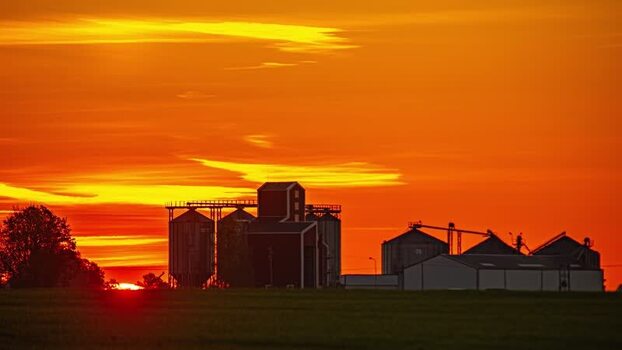 View of grain silos at sunset in Latvia.
