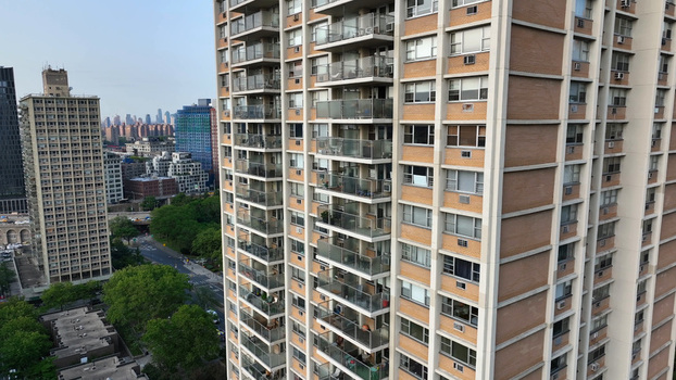Aerial view of high rise residential apartment buildings with balconies and brick facades in an urban neighborhood in Brooklyn New York New York United States. Aerial view of high rise residential apartment buildings with balconies and brick facades in an urban neighborhood in Brooklyn New York New York United States.