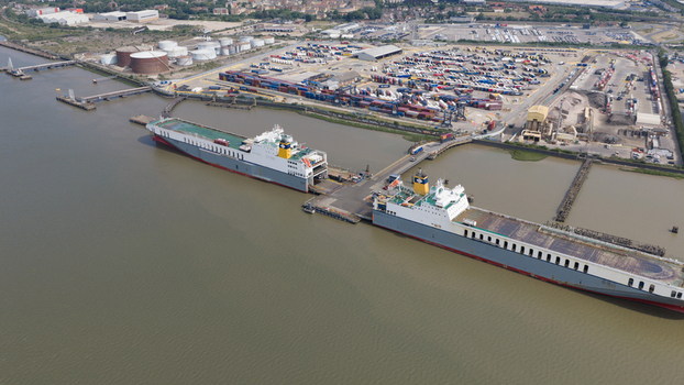 Purfleet on Thames United Kingdom 10 July 2026 Aerial view of the Purfleet Container terminal with cargo ships docked at the pier shipping containers and industrial infrastructure.