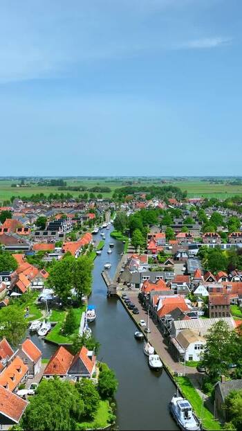 Aerial view of the canal and red roofed houses in Workum Netherlands.