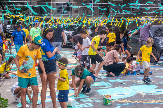 Rio de Janeiro Brazil 13 June 2026 View of people and children in Brazil jerseys painting the street with festive decorations for the World Cup 2026 celebration.