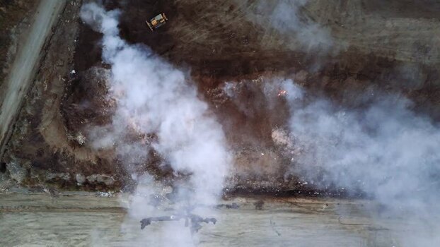 Aerial view of smoke at a landfill in Sremska Mitrovica Serbia.