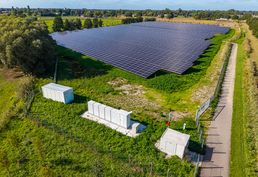 Aerial view of Solar Park with rows of photovoltaic panels and battery energy storage system in Ede Gelderland Netherlands. Aerial view of Solar Park with rows of photovoltaic panels and battery energy storage system in Ede Gelderland Netherlands.