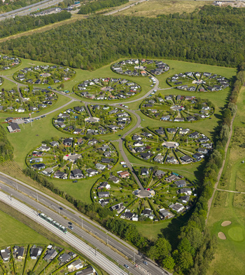 Aerial view of the unique circular garden communities of Brondby Haveby with lush green lawns and houses arranged in circles Brondby Denmark. Aerial view of the unique circular garden communities of Brondby Haveby with lush green lawns and houses arranged in circles Brondby Denmark.