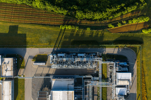 Aerial view of the UGS Damborice gas storage facility with industrial pipes and buildings surrounded by lush green fields Damborice South Moravian Region Czechia. Aerial view of the UGS Damborice gas storage facility with industrial pipes and buildings surrounded by lush green fields Damborice South Moravian Region Czechia.