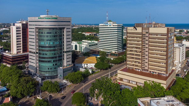 Accra Ghana 26 May 2023 Aerial view of the Africa Trade House and surrounding modern office buildings in the city center featuring lush green trees and clear blue skies. Accra Ghana 26 May 2023 Aerial view of the Africa Trade House and surrounding modern office buildings in the city center featuring lush green trees and clear blue skies.