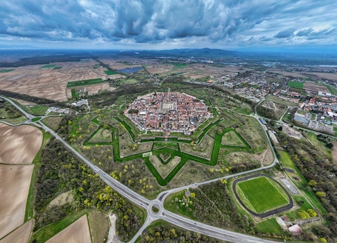 Aerial view of the star shaped fortress city a testament to military architecture with its symmetrical bastions moats and red roofed buildings Neuf Brisach Grand Est France.