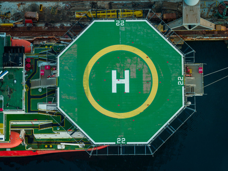 Aerial view of the helipad on a ship at Uljanik Shipyard with green deck markings and safety railings in Pula Croatia. Aerial view of the helipad on a ship at Uljanik Shipyard with green deck markings and safety railings in Pula Croatia.
