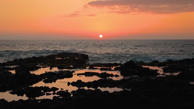 View of a sunset over rocky coastline United States.