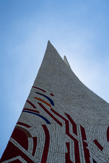 Bratislava Slovakia 09 May 2026 View of the mosaic covered pylon of a modernist monument reaching towards a clear blue sky.