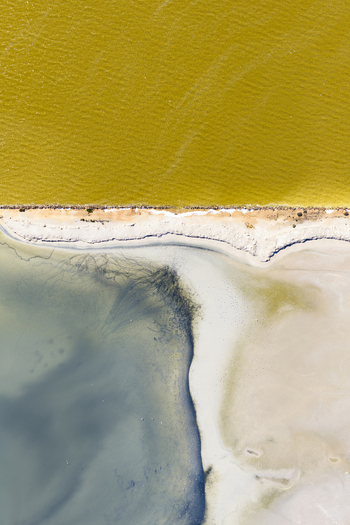 Aerial view of the striking contrast of golden and grey waters divided by a thin strip of land San Pedro del Pinatar Region of Murcia Spain. Aerial view of the striking contrast of golden and grey waters divided by a thin strip of land San Pedro del Pinatar Region of Murcia Spain.