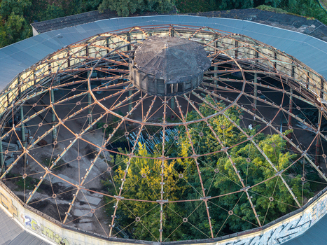 Aerial view of locomotive roundhouse Rummelsburg with its exposed metal roof structure and overgrown interior vegetation in Berlin Berlin Germany. Aerial view of locomotive roundhouse Rummelsburg with its exposed metal roof structure and overgrown interior vegetation in Berlin Berlin Germany.