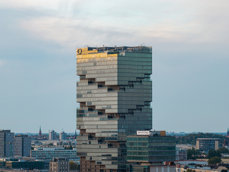 Aerial view of the EDGE East Side Tower featuring its unique stacked glass facade and modern architectural design rising above the urban skyline of Berlin Berlin Germany. Aerial view of the EDGE East Side Tower featuring its unique stacked glass facade and modern architectural design rising above the urban skyline of Berlin Berlin Germany.