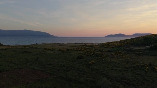 Aerial view of coastal hills and sea at sunset in Albania. Aerial view of coastal hills and sea at sunset in Albania.