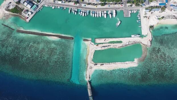 Aerial view of the harbor and turquoise waters in Maldives. Aerial view of the harbor and turquoise waters in Maldives.