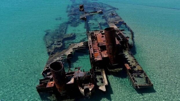 Aerial view of Shipwreck Epanomi in turquoise waters Greece.