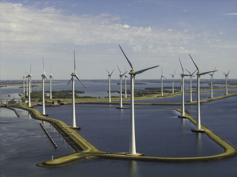 Aerial view of Grevelingendam wind farm with rows of wind turbines standing in the water connected by narrow embankments in Bruinisse Zeeland Netherlands. Aerial view of Grevelingendam wind farm with rows of wind turbines standing in the water connected by narrow embankments in Bruinisse Zeeland Netherlands.