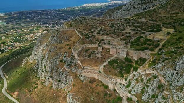 Aerial view of Acrocorinth fortress ruins on a rocky hill Greece.