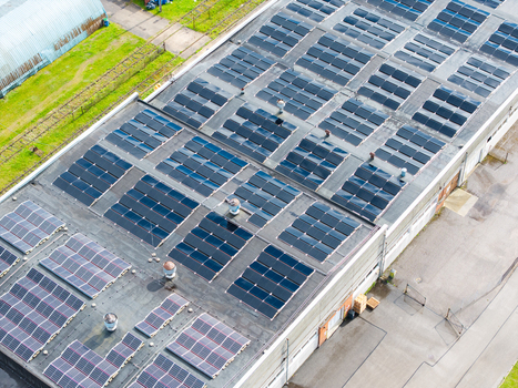 Aerial view of solar panels installed on the flat roof of an industrial building in Olaine Olaine Municipality Latvia. Aerial view of solar panels installed on the flat roof of an industrial building in Olaine Olaine Municipality Latvia.