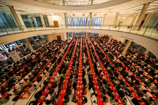 Dhaka Bangladesh 19 March 2025 View of thousands of worshippers in solemn devotion on vibrant red mats within a grand modern mosque hall. Dhaka Bangladesh 19 March 2025 View of thousands of worshippers in solemn devotion on vibrant red mats within a grand modern mosque hall.