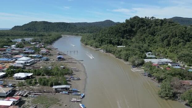 Aerial view of river and village in Sarawak Malaysia. Aerial view of river and village in Sarawak Malaysia.