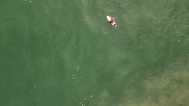 Aerial view of surfer at Praia da Mata Portugal. Aerial view of surfer at Praia da Mata Portugal.