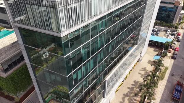 Aerial view of modern glass office building in India.