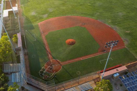 Aerial view of the baseball field at Sports Town USA with green grass red dirt infield and stadium lights in Las Vegas Nevada United States. Aerial view of the baseball field at Sports Town USA with green grass red dirt infield and stadium lights in Las Vegas Nevada United States.