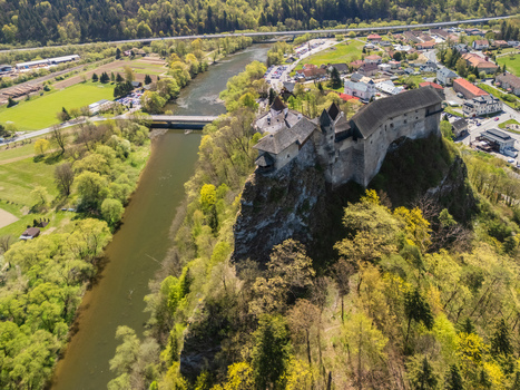 Aerial view of Orava Castle perched on a high rock cliff above the river and green forests in Dolny Kubin Zilinsky kraj Slovakia. Aerial view of Orava Castle perched on a high rock cliff above the river and green forests in Dolny Kubin Zilinsky kraj Slovakia.