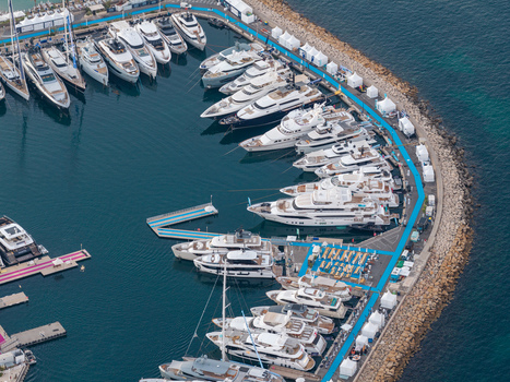 Aerial view of luxury yachts docked at the marina in Cannes Provence Alpes Cote d Azur France. Aerial view of luxury yachts docked at the marina in Cannes Provence Alpes Cote d Azur France.