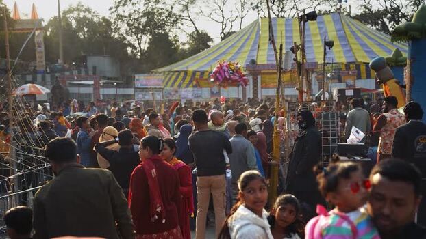 View of a large crowd at a fair with a circus tent Bangladesh. View of a large crowd at a fair with a circus tent Bangladesh.