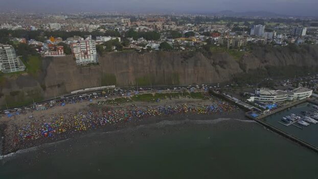 Aerial view of Circuito de Playas with crowded beach in Peru. Aerial view of Circuito de Playas with crowded beach in Peru.